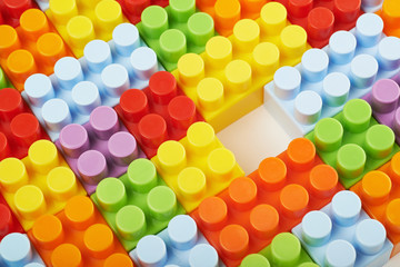 Surface covered with toy bricks