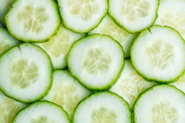 Fototapeta premium Slices of cucumber as background