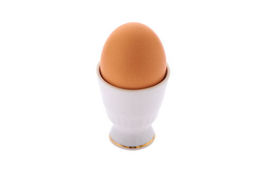Egg on a stand on a white isolated background