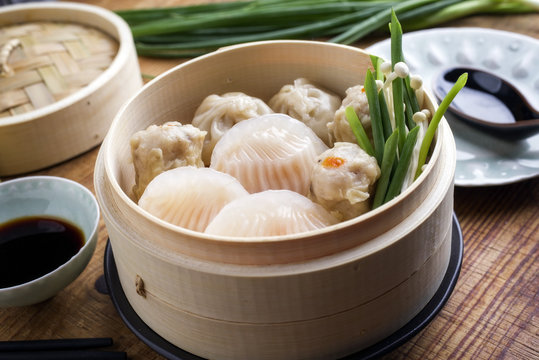 Traditional Chinese Dim Sum as close-up on Bamboo Steamer