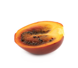 Half of a ripe tamarillo fruit isolated