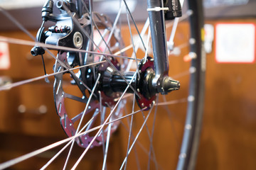 Fototapeta na wymiar Bicycle wheel on blurred background