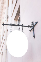 Mock up sign. Blank rounded signage on a building wall