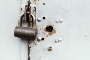 The old door locked with a padlock hanging brackets. Set of backgrounds