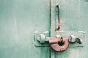 The old door locked with a padlock hanging brackets. Set of backgrounds