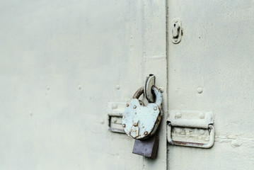 The old door locked with a padlock hanging brackets. Set of backgrounds