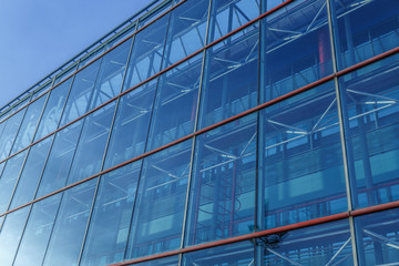 Fototapeta na wymiar View of a blue building of many windows