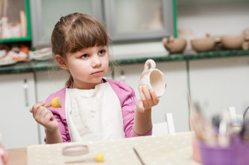 girls in the studio are made of ceramic cups 