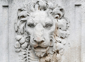 Fototapety  old Lion head relief on the facade