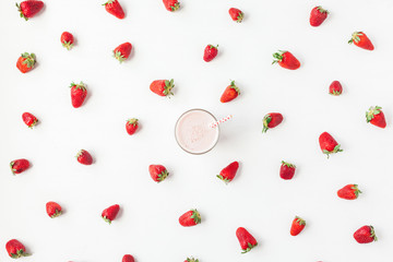 Strawberry milkshake, fresh strawberry on white background. Summer concept. Flat lay, top view