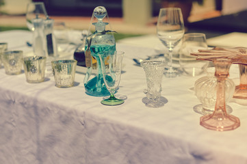 Catered service and tables ready for food eating event reception, busy light background