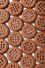 Chocolate cookies with cream on a white background