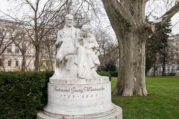 Obraz premium white statue of painter and writer Ferdinand Georg Waldmuller in Rathauspark