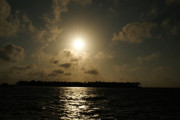 Sunset behind an island