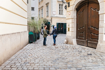 Romantic couple tourist walking together in Europe narrow street