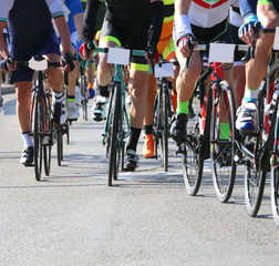 Fototapeta na wymiar Fast cyclists during the race on city roads