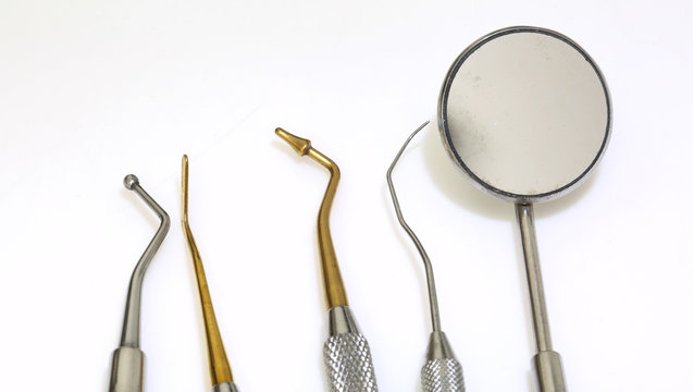 five dental tools for cleaning the teeth and checking the caries