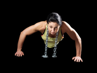 Fototapeta na wymiar Muscular bodybuilder woman showing her muscles.