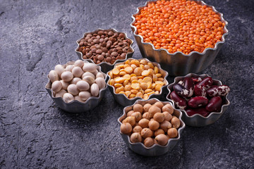 Various legumes. Chickpeas, red lentils, black lentils, yellow peas and beans