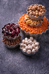 Various legumes. Chickpeas, red lentils, black lentils, yellow peas and beans