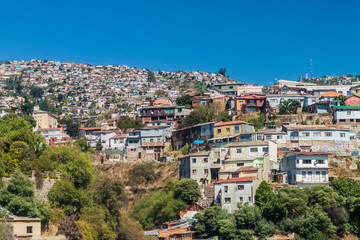 Fototapeta na wymiar Colorful houses on hills in Valparaiso, Chile