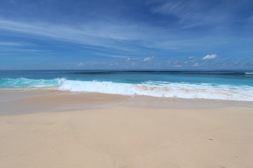 Fototapeta na wymiar Bali beach with whate sand and blue waves in Bukit