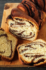 Sweet marbled brioche plait with nuts and chocolate
