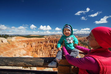 Fototapeta na wymiar A woman with her baby boy are hiking in Bryce canyon National Park, Utah, USA