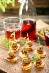 Baked potatoes spanish snack with sausage chorizo and green olive