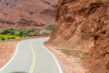 Road through Quebrada de Cafayate valley, which is full of colorful rock formations, northern Argentina.