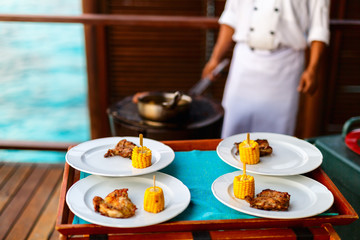 Grilled meat and corn