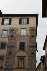 Fragment of old building in Lucca. Italy.