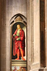 Obraz premium Painting San Giuliano by Francesco Botticini and Jacopo del Sellaio in Orsanmichele Church, Florence, Italy.
