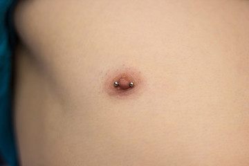 Pierced male nipple