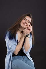 Portrait of young caucasian girl on black background