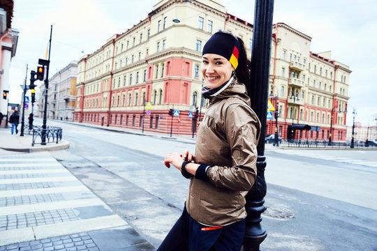 A girl runner preparing to run on a crossroad of Saint Peterburg
