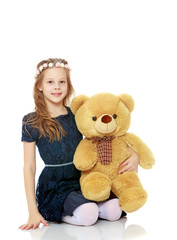 Girl with a Teddy bear.