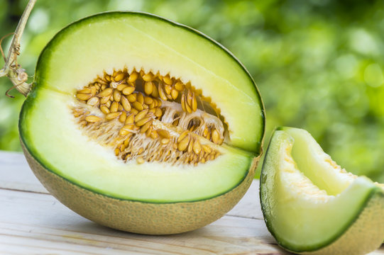 Ripe sweet melon on table in garden