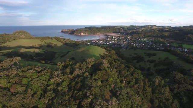 Matapouri village, forest and white sand bays, coastline aerial New Zealand