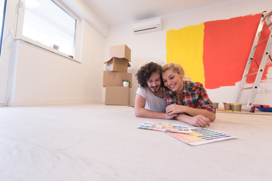 Happy Young Couple Relaxing After Painting