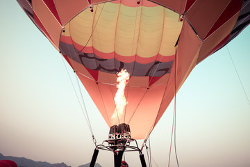 Close-up of Hot Air Balloons with fire with sky background applying retro and vintage filter effect styles.