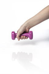 woman hand hold a pink dumbbell isolated white.