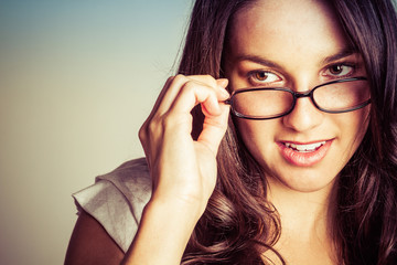 Woman Looking Over Glasses