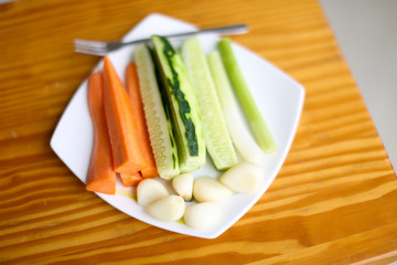 Healthy Eating. Superfoods. Onions, cucumber, carrots, and garlic.