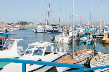 Yachts moored at the pier on the marina in the old town of Acre in Israel