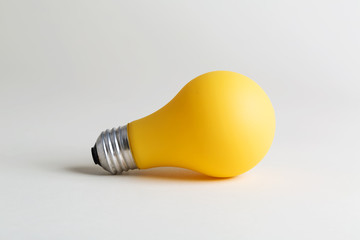 Colored lightbulb on a white background