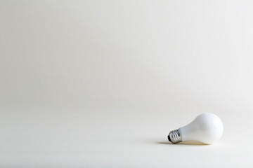 Colored lightbulb on a white background