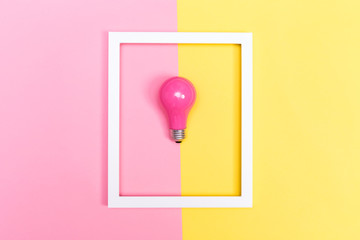 Colored lightbulb on a duotone background