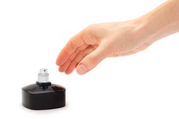 woman hand holding perfume bottle.