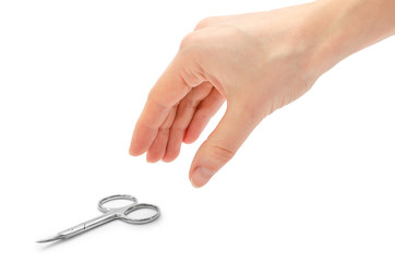 woman hand holding manicure scissors.
